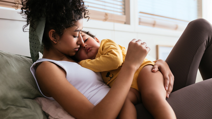 toddler night terrors, woman holding sleeping toddler